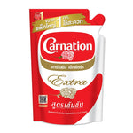 CARNATION Extra Evaporated Creamer 1kg in dry grocery packaging, white powdered creamer for coffee and cooking.
