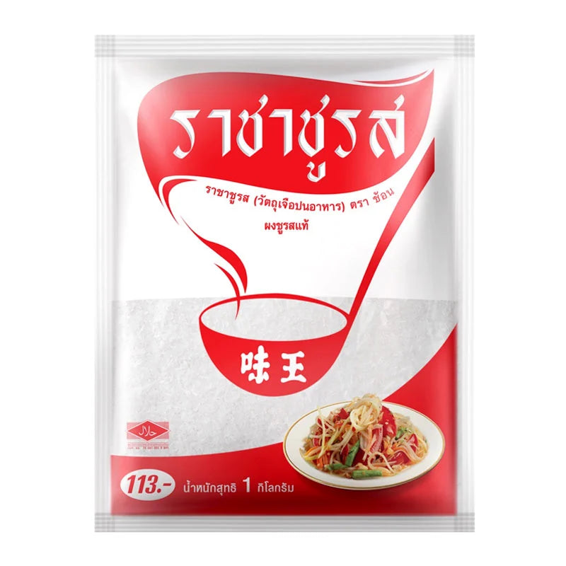 Spoon MSG 1 Kg container showing white granulated seasoning in a clear plastic jar with a blue lid