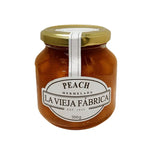 Jar of LA Vieja Fabrica Peach Mermelada 350g with visible peach chunks and orange-colored jam inside.