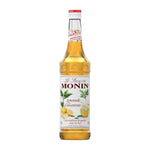 Monin Lemonade Concentrate Syrup 700ml in clear bottle, suitable for making refreshing lemon-flavored beverages.