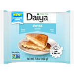 Daiya vegan Swiss cheese slices stacked on a plate, showcasing their creamy texture and plant-based ingredients.