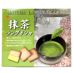 Nikko Matcha Langue De Chat cookie on a white plate, showcasing its crispy texture and green matcha flavor in a close-up view.