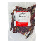 Makro Dried Goat Pepper 100g in a clear container, showing small, dark dried peppercorns for culinary use.