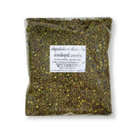 Close-up of Tontawan Mala Seeds in a 250g package, showcasing dry grocery product from TONTAWAN with seeds spread out.