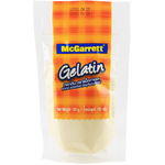 McGarrett Gelatine Powder in a clear jar, used for cooking and baking, with a white scoop on a kitchen countertop.