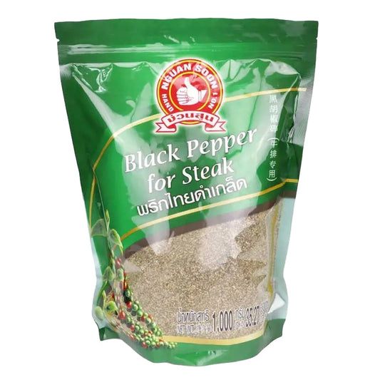 Black pepper flakes in a 1 kg package from No.1 Hand Brand, showing the textured, flaky pepper pieces.