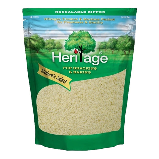 HERITAGE Raw Almond Powder in a 500g package, close-up of the light brown, finely ground almond powder on a white background.