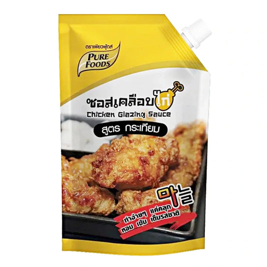 Pure Foods garlic flavor chicken sauce in a 1 kg jar, showcasing the rich, savory sauce with garlic infusion in a clear container.
