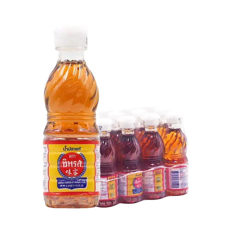 TIPAROS Fish Sauce 60 ml bottles stacked, featuring clear glass bottles with dark fish sauce inside, arranged in a group.