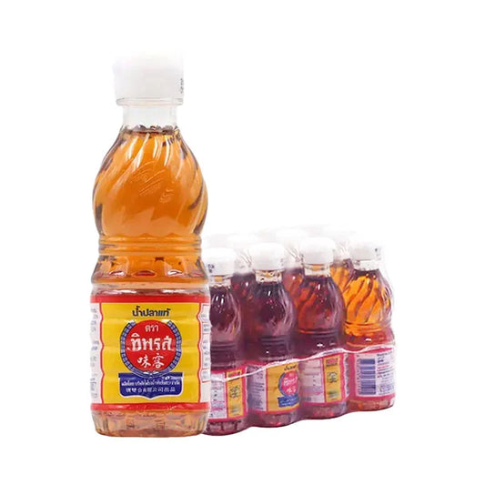 TIPAROS Fish Sauce 60 ml bottles stacked, featuring clear glass bottles with dark fish sauce inside, arranged in a group.