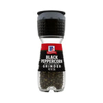 Mccormick Black Pepper 28g container, dry grocery spice jar with black peppercorns and label.