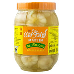 MAE JIN Garlic Pickle in 870g jar, a dry grocery product with chopped garlic and spices in a clear jar.