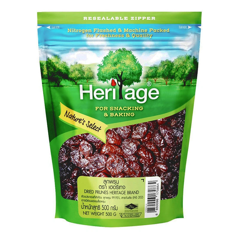HERITAGE dried seedless prunes in a 500g package, showing plump, dark purple prune fruits with smooth skin.