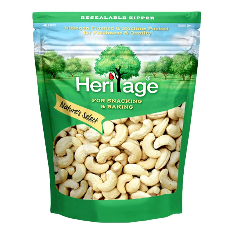 HERITAGE toasted cashew nuts in a 500g package, showing golden-brown, roasted cashews on a white background.