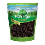 Heritage black raisins in a 1kg package, dry grocery product, showing close-up of plump, dark dried grapes.