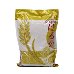 Haruka Parboiled Rice in a clear grocery bag, showing white, polished grains suitable for cooking and everyday meals.