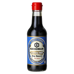 Kikkoman Gluten Free Soy Sauce bottle, 10 oz, in a grocery setting with label visible and pour spout for cooking or dipping.