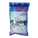 Fresh Khob Fah Keaw Flower of Salt in a clear container, showcasing its flaky white salt crystals for culinary use.