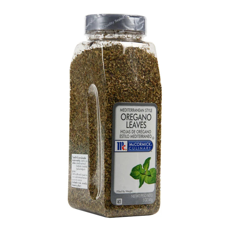 Fresh McCormick oregano leaves in a 141g package, showcasing green, dried herb leaves ideal for seasoning dishes.