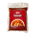 Ajar of ARO Red Curry Paste in 250g container, showcasing the vibrant red paste inside, suitable for Thai cooking.