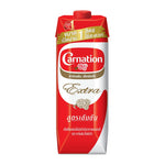 Carnation Extra Evaporated Creamer 1L in a plastic container, ideal for cooking and baking, from the dry grocery section.
