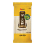 Sempio Wheat Noodles Soft & Thick 900g dry grocery package, showcasing the uncooked noodles in a clear bag.