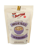 A bowl of Bob's Red Mill gluten-free muesli with oats, nuts, and dried fruit, showcasing a healthy breakfast option.