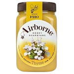 Airborne Thyme Honey in a jar, natural grocery product, golden honey with thyme infusion, suitable for cooking and health remedies.