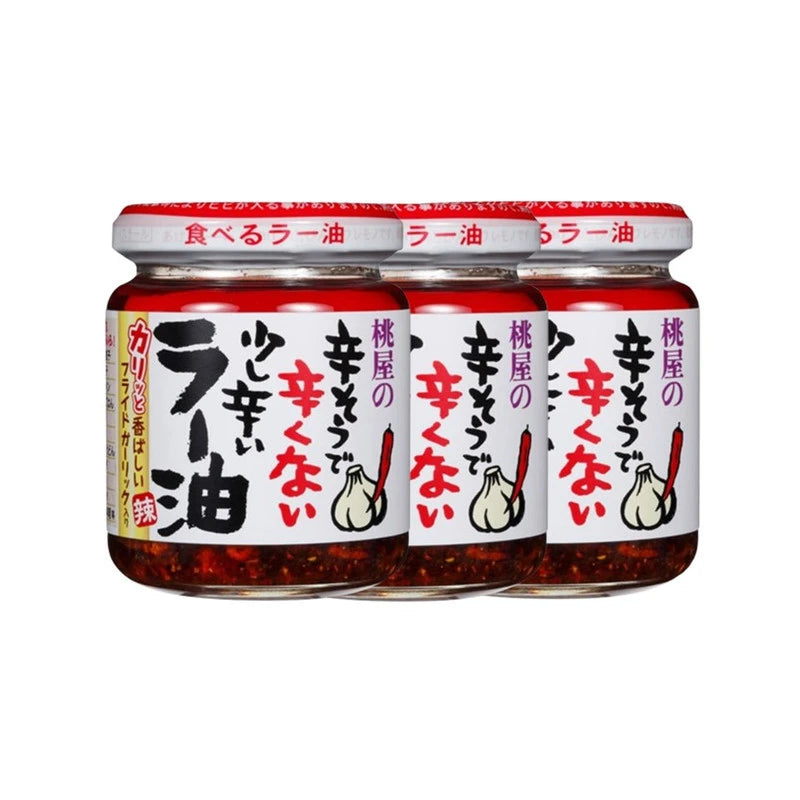 MOMYAO Taberu Layu Chili Oil bottles with rapeseed oil and fried garlic, 110g each, arranged in a row.