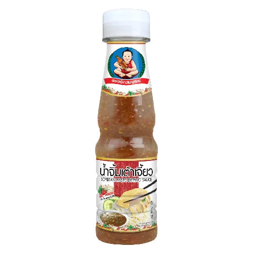 DEKSOMBOON soybean paste dipping sauce in 175g jar, close-up of dark, thick sauce with label showing on the jar