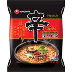 Nong Shim Shin Ramyun Black instant ramen noodles in a bowl with broth, garnished with vegetables and sliced meat.