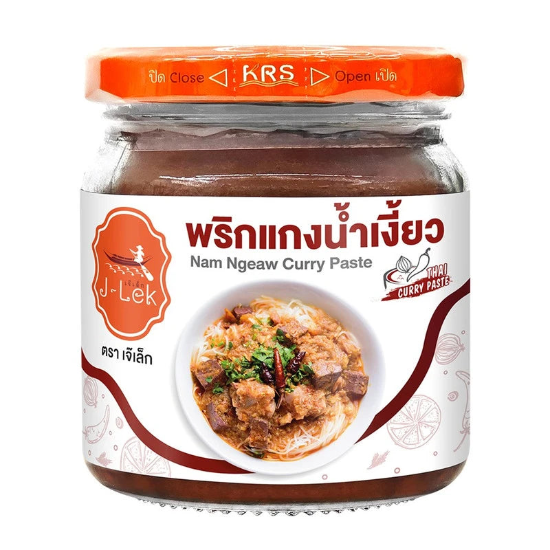J-Lek Nam Ngiao curry paste in 195g jar, featuring Thai-style spicy and flavorful Nam Ngiao ingredients with red chili and herbs.