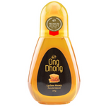 Jar of Ong Dhong Lychee Honey with a golden hue, showcasing the smooth honey texture on a white background.
