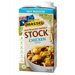 Massel Organic Liquid Stock Chicken Style in a clear bottle, showcasing the golden liquid used for cooking and flavoring dishes.