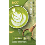 Ucc Matcha Latte drink in a glass with frothy green matcha topping and creamy milk, served in a clear glass.