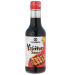 Kikkoman Yakitori Sauce bottle, soy-based Japanese cooking sauce with a red cap and label, used for grilling and glazing meats.