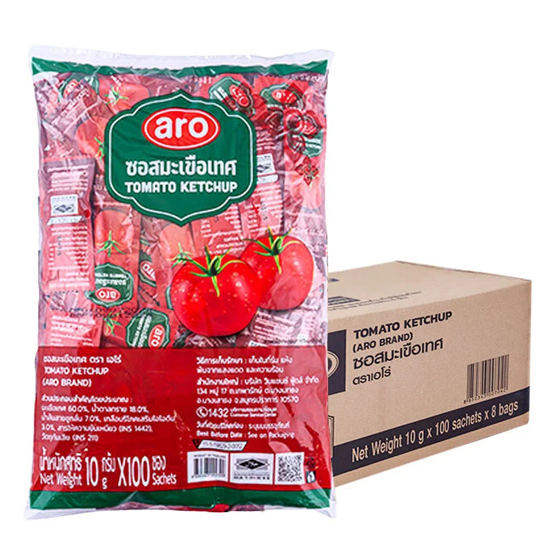 A row of 100 ARO Tomato Sauce sachets, each 10g, neatly arranged in stacks with branded packaging visible.