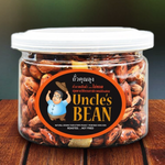Uncle's Bean roasted tiger-stripe peanut confectionery snack in a clear container showing the striped pattern and crunchy texture.