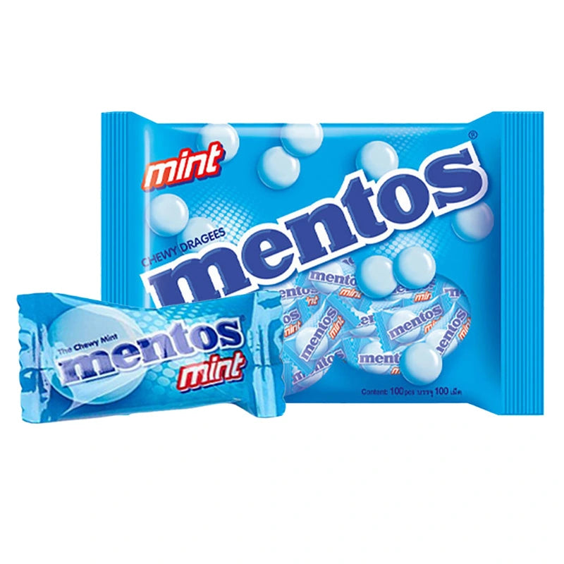 Assorted MENTOS Soft Candy Mint candies in a clear container, showcasing individual mint candies with colorful wrapping.