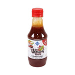 Tutiya Picante Sukiyaki and BBQ Sauce bottle in dry grocery aisle, featuring spicy, flavorful sauce for Japanese and grilled dishes.