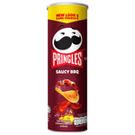 Pringles BBQ flavored snack chips in a can, showcasing the crispy, ridged texture and smoky barbecue seasoning on the surface.