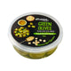 Makro green olives with feta cheese in a clear bowl, showing the vibrant green olives and crumbled feta on top.