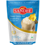 Sandee Rice Premium Glutinous rice grains in a clear bag, showcasing their sticky and translucent appearance for cooking.