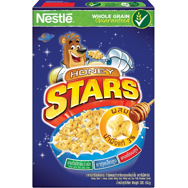 Nestle Honey Stars cereal box with bright yellow packaging and star-shaped cereal pieces displayed.