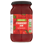 Sainsbury's seedless strawberry jam jar with red jam inside, labeled with brand logo and product name on the grocery shelf.