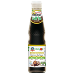 Deksomboon Mushroom Soy Sauce bottle from the grocery aisle, showcasing the healthy fit product with a label and packaging.