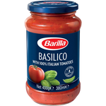 Bottle of Barilla Basilico Tomato & Basil Sauce with fresh basil and ripe tomatoes, ideal for pasta dishes.