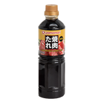 Bottle of Yamamori Yakiniku No Tare sauce, Japanese BBQ marinade in a clear plastic bottle with a green cap.