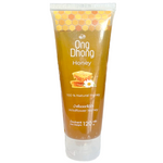 Jar of Ong Dhong Wildflower Honey with golden honey drizzling from the spoon, showcasing natural, pure honey.