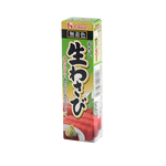 House Wasabi jar, bright green Japanese horseradish condiment for sushi and Asian dishes, in a clear glass container.